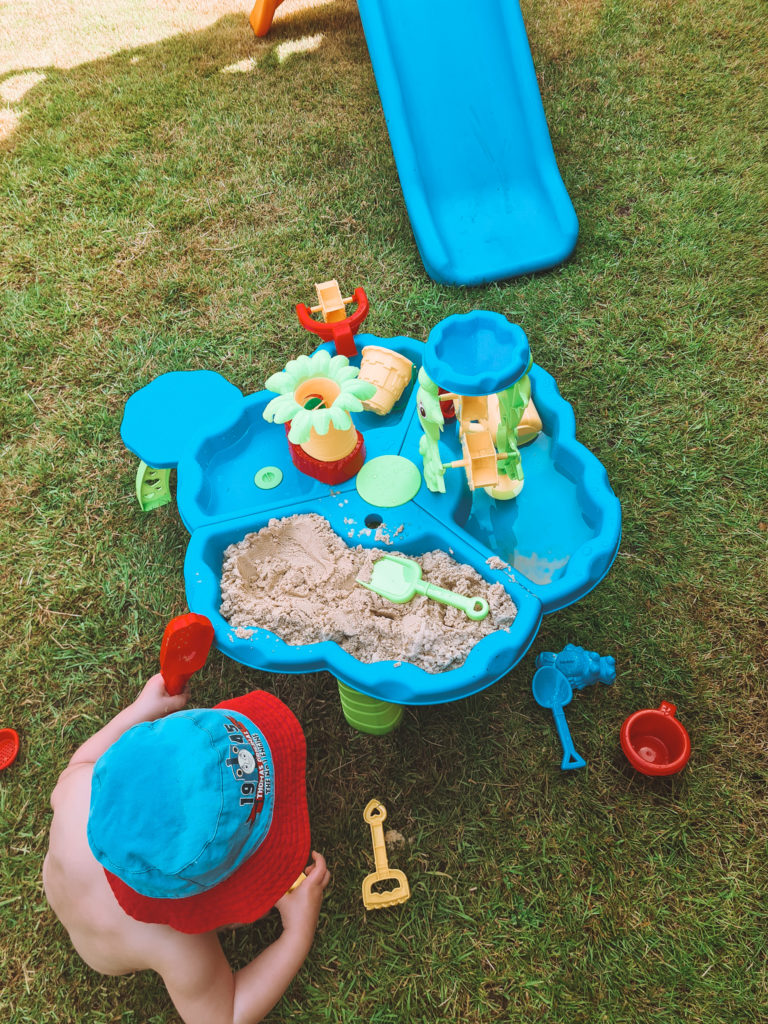 aidan playing at sand & water table